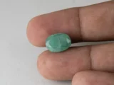 Zambian Emerald 6.16 Carat (6.77 Ratti) Panna Stone in hand for true scale and color