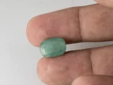 Zambian Emerald 6.45 Carat (7.09 Ratti) Panna Stone in hand for true scale and color