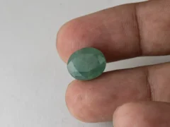 Zambian Emerald 7.15 Carat (7.86 Ratti) Panna Stone in hand for true scale and color