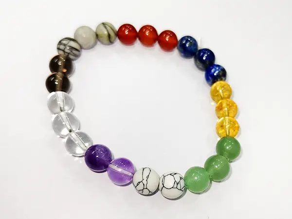 Home 67 Navratna Bracelet — Multicolor Quartz (Elastic) top view, 9-color arrangement