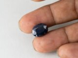 Bangkok Blue Sapphire Neelam 10.28 Carat in hand showing real size 14mm spread