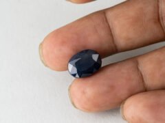 Bangkok Blue Sapphire Neelam 10.28 Carat in hand showing real size 14mm spread
