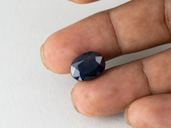 Bangkok Blue Sapphire Neelam 10.28 Carat in hand showing real size 14mm spread