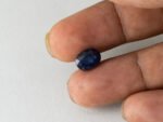 Bangkok Blue Sapphire Neelam 3.86 Carat in hand showing real size 10.3mm length