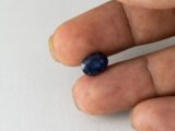 Bangkok Blue Sapphire Neelam 3.86 Carat in hand showing real size 10.3mm length
