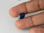 Bangkok Blue Sapphire Neelam 5 Carat in hand showing real size 10.9mm spread