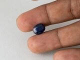 Bangkok Blue Sapphire Neelam 5 Carat in hand showing real size 10.9mm spread