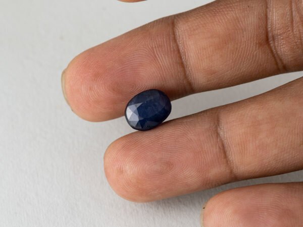 Bangkok Blue Sapphire Neelam 5 Carat in hand showing real size 10.9mm spread