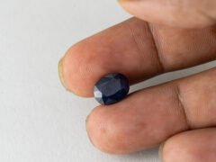 Bangkok Blue Sapphire Neelam 6.03 Carat in hand showing real size 11.1mm length