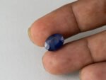 Bangkok Blue Sapphire Neelam 6.5 Carat in hand showing real size 12.5mm length