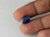 Bangkok Blue Sapphire Neelam 6.5 Carat in hand showing real size 12.5mm length
