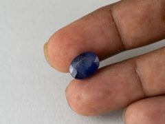 Bangkok Blue Sapphire Neelam 6.5 Carat in hand showing real size 12.5mm length