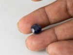 Bangkok Blue Sapphire Neelam 7 Carat in hand showing real size 9.7mm spread