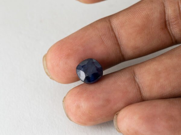 Bangkok Blue Sapphire Neelam 7 Carat in hand showing real size 9.7mm spread