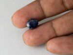 Bangkok Blue Sapphire Neelam 7.02 Carat in hand showing real size 10.8mm spread