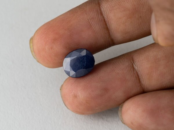Bangkok Blue Sapphire Neelam 7.9 Carat in hand showing real size 12.3mm spread