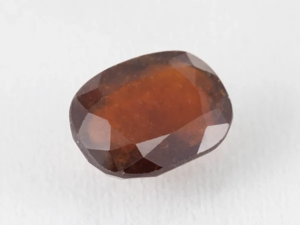 Hessonite Garnet 11.6 Carat side view showing 6.4mm depth and cut quality.