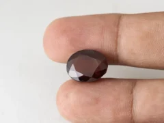 Gomed Stone 12.2 Carat in hand showing real 15.2mm size.