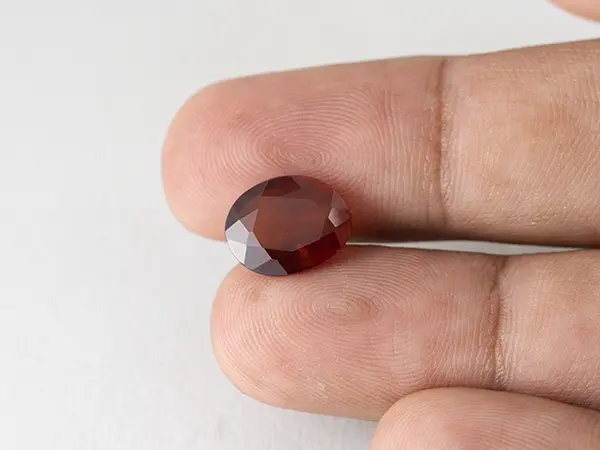 African Gomed Stone 5.1 Carat (5.60 Ratti) Natural Certified Hessonite 3 Gomed Stone 5.1 Carat in hand showing real 12.7mm size.
