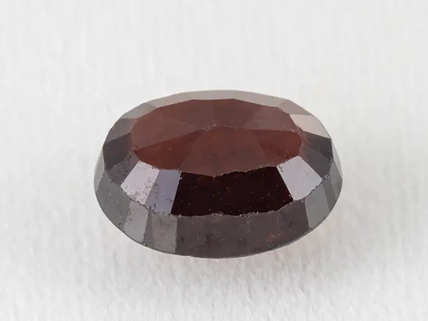 African Gomed Stone (Hessonite) 5.61 Carat (6.16 Ratti) — Oval Cut 2 African Gomed Hessonite 5.61 Carat back view pavilion facets visible