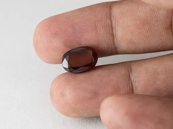 Gomed Stone 6.35 Carat in hand showing real 12.7mm size.