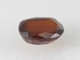 Hessonite Garnet 6.35 Carat side view showing 5.6mm depth and cut quality.