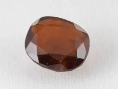 Hessonite Garnet 6.66 Carat side view showing 5.5mm depth and cut quality.