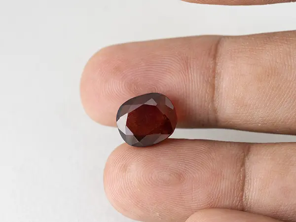 African Gomed Stone 6.66 Carat (7.32 Ratti) Natural Certified Hessonite 4 Gomed Stone 6.66 Carat in hand showing real 12.1mm size.