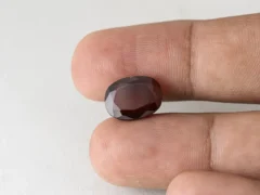 Gomed Stone 7.6 Carat in hand showing real 13.5mm size.