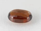 Hessonite Garnet 7.75 Carat side view showing 5.6mm depth and cut quality.