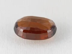 Hessonite Garnet 7.75 Carat side view showing 5.6mm depth and cut quality.