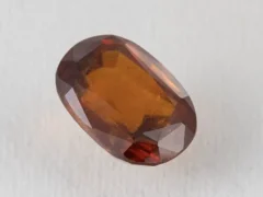 Hessonite Garnet 8.4 Carat side view showing 6.9mm depth and cut quality.