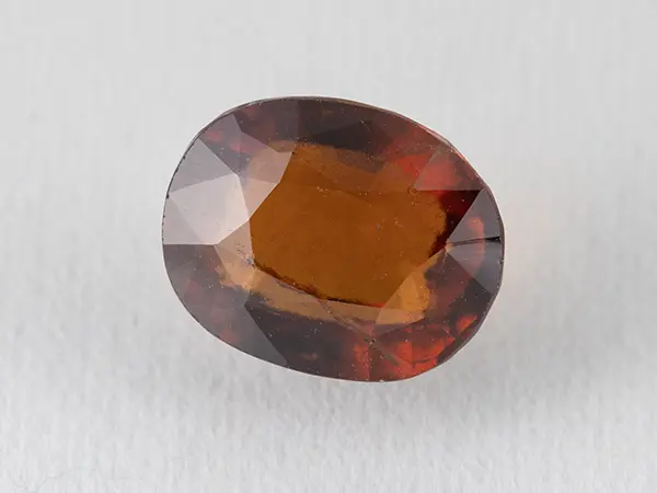 African Gomed Stone 8.7 Carat (9.56 Ratti) Natural Certified Hessonite 1 African Gomed Stone 8.7 Carat natural Hessonite with brown colour, oval cut.
