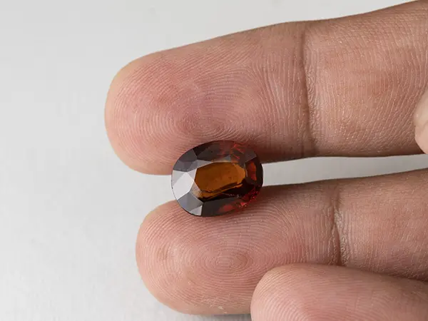 African Gomed Stone 8.7 Carat (9.56 Ratti) Natural Certified Hessonite 3 Gomed Stone 8.7 Carat in hand showing real 12.8mm size.