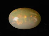 Ethiopian Fire Opal 10.02 Carat side profile showing 8.5mm depth and oval cut proportions