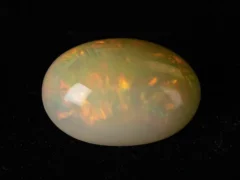 Ethiopian Fire Opal 10.02 Carat side profile showing 8.5mm depth and oval cut proportions