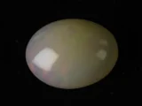 Natural Ethiopian Fire Opal 11.06 carat oval white with rainbow play-of-color
