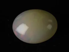 Natural Ethiopian Fire Opal 11.06 carat oval white with rainbow play-of-color