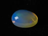 Ethiopian Fire Opal 4.73 Carat side profile showing 7.1mm depth and oval cut proportions