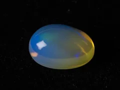 Ethiopian Fire Opal 4.73 Carat side profile showing 7.1mm depth and oval cut proportions