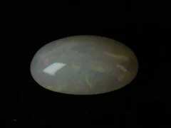 Ethiopian Fire Opal 6.61 Carat side profile showing 7mm depth and elongated oval proportions