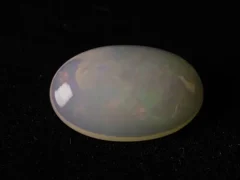 Ethiopian Fire Opal 7.94 Carat side profile showing 6mm depth and oval cut proportions
