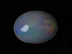 Natural Ethiopian Fire Opal 3.40 carat oval white with rainbow play-of-color