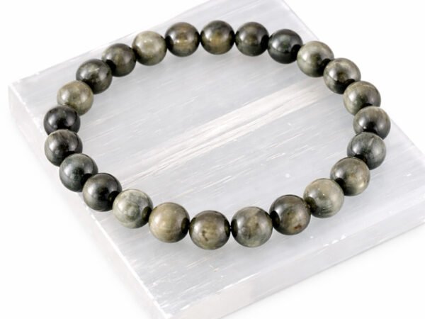 Cat’s Eye Lehsunia gemstone bracelet displayed on selenite plate