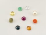 Navratna gemstones back view showing pointed bottom cut of Ruby, Emerald, Yellow Sapphire, Blue Sapphire and other natural stones