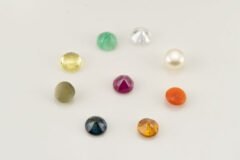 Navratna gemstones back view showing pointed bottom cut of Ruby, Emerald, Yellow Sapphire, Blue Sapphire and other natural stones