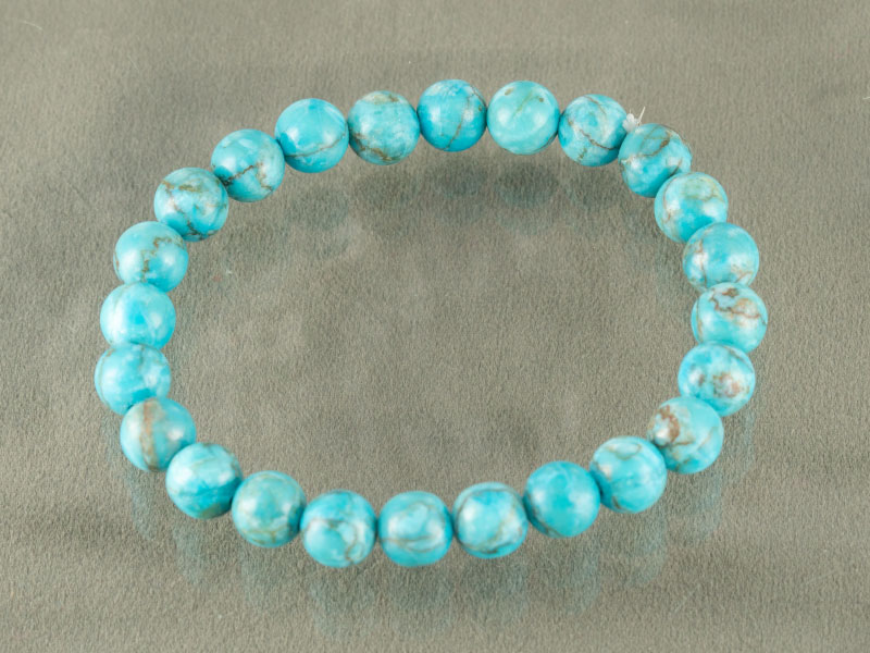Turquoise Firoza Bracelet (Natural Quartz) – Certified 2 Top view of Turquoise Firoza quartz bracelet isolated on grey background