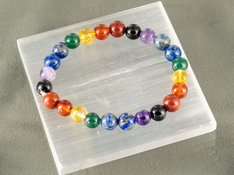 Natural Seven Chakra Bracelet (8mm Beads) 3 Angled view of multi-color healing beads for yoga and meditation