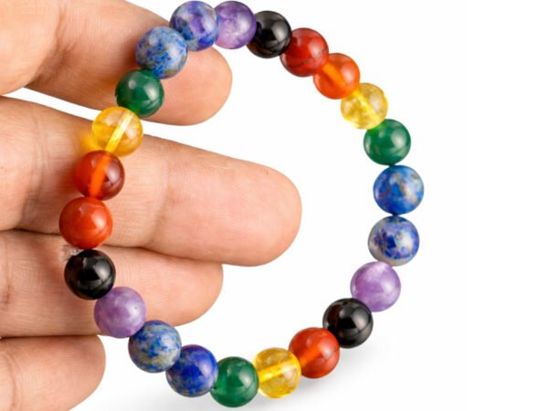 7 Chakra bracelet held in hand showing multicolor 8mm beads