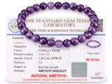 Amethyst bracelet placed over gem testing certificate showing 8mm beads